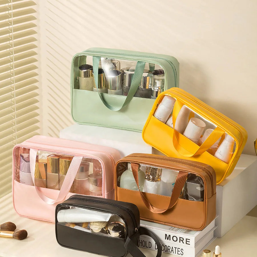 Set of colorful matte translucent toiletry bags with zipper closures and top handles, used to store skincare and travel-size bottles on a vanity